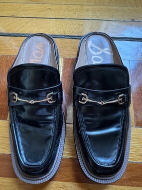 Sam Edelman Black Women’s Mule Lug-Sole Loafers with Gold Bit Detail